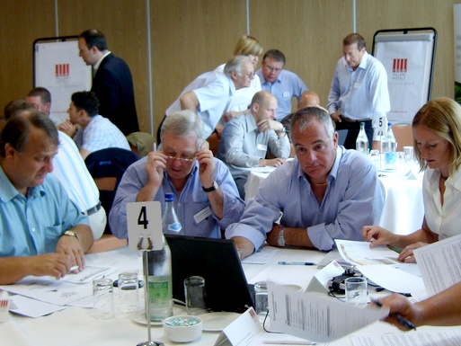 Teams at tables during a simulation event