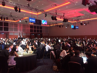 Conference hall with around 600 graduate recruits in 84 teams taking part in a banking simulation