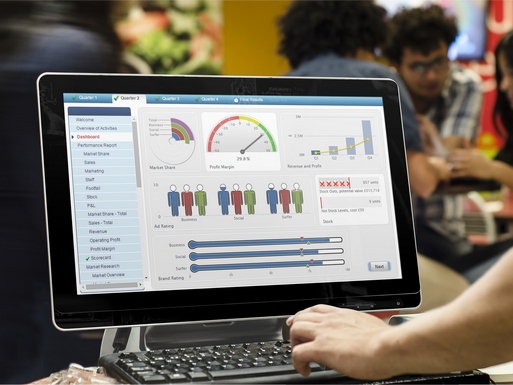 Screen showing dashboard from retail sim, with hand coming in to type on keyboard