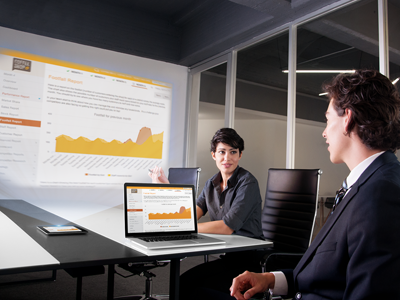 Team members viewing footfall figures in entrepeneur simulation